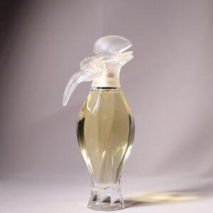 An artistic glass perfume bottle showcasing elegance and style, perfect for fragrance promotions.
